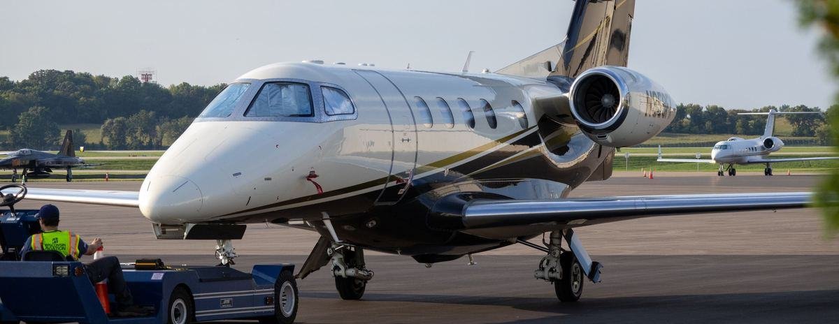 Business jet being moved on the apron by a tug during an aircraft recovery