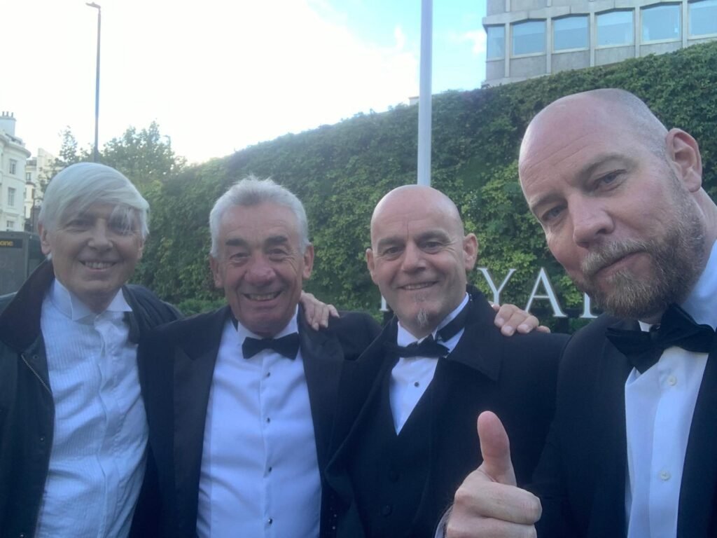 Carl Griffiths (right) with friends at a black-tie event