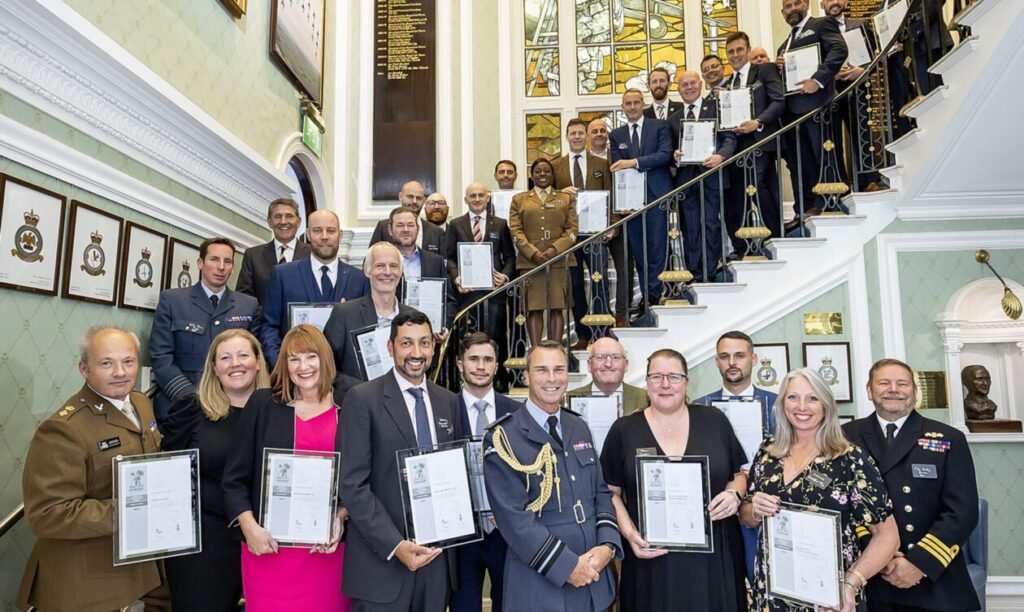 Carl Griffiths with award recipients at the Royal Air Force Club in London